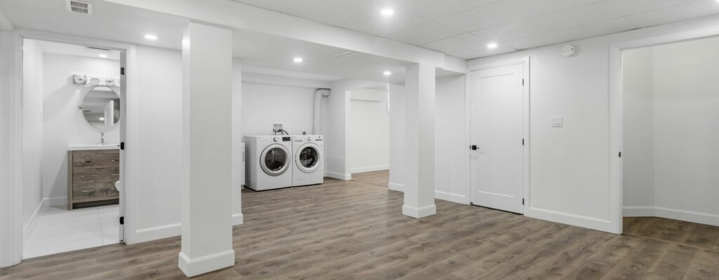 an empty room with a washer and dryer